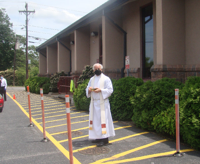Fr. Larry looking Dapper in his white robes Memorial Day Weekend